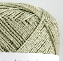 Macro shot of Pierrot Julien silk strands, highlighting the smooth, consistent filament and the high-end pearlescent sheen. 

Pierrot Julien Silk Yarn skeins in Pickle green colour.