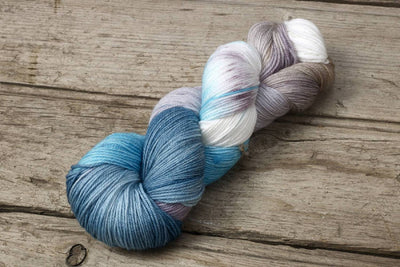 Hand dyed blue light grey colour hues yarn by Alegria Yarn by Manos del Uruguay. 75% Superwash Merino Wool, 25% Polyamide (Nylon) for durability.