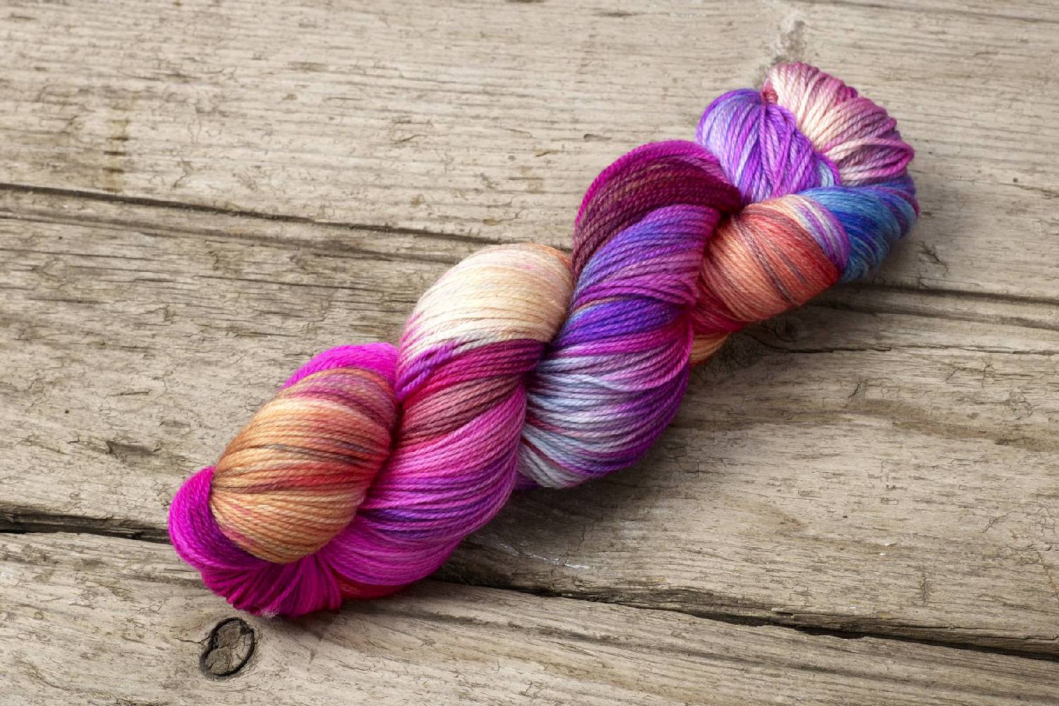 Hand dyed Multicolored skein of yarn by Alegria Yarn by Manos del Uruguay. 75% Superwash Merino Wool, 25% Polyamide (Nylon) for durability.