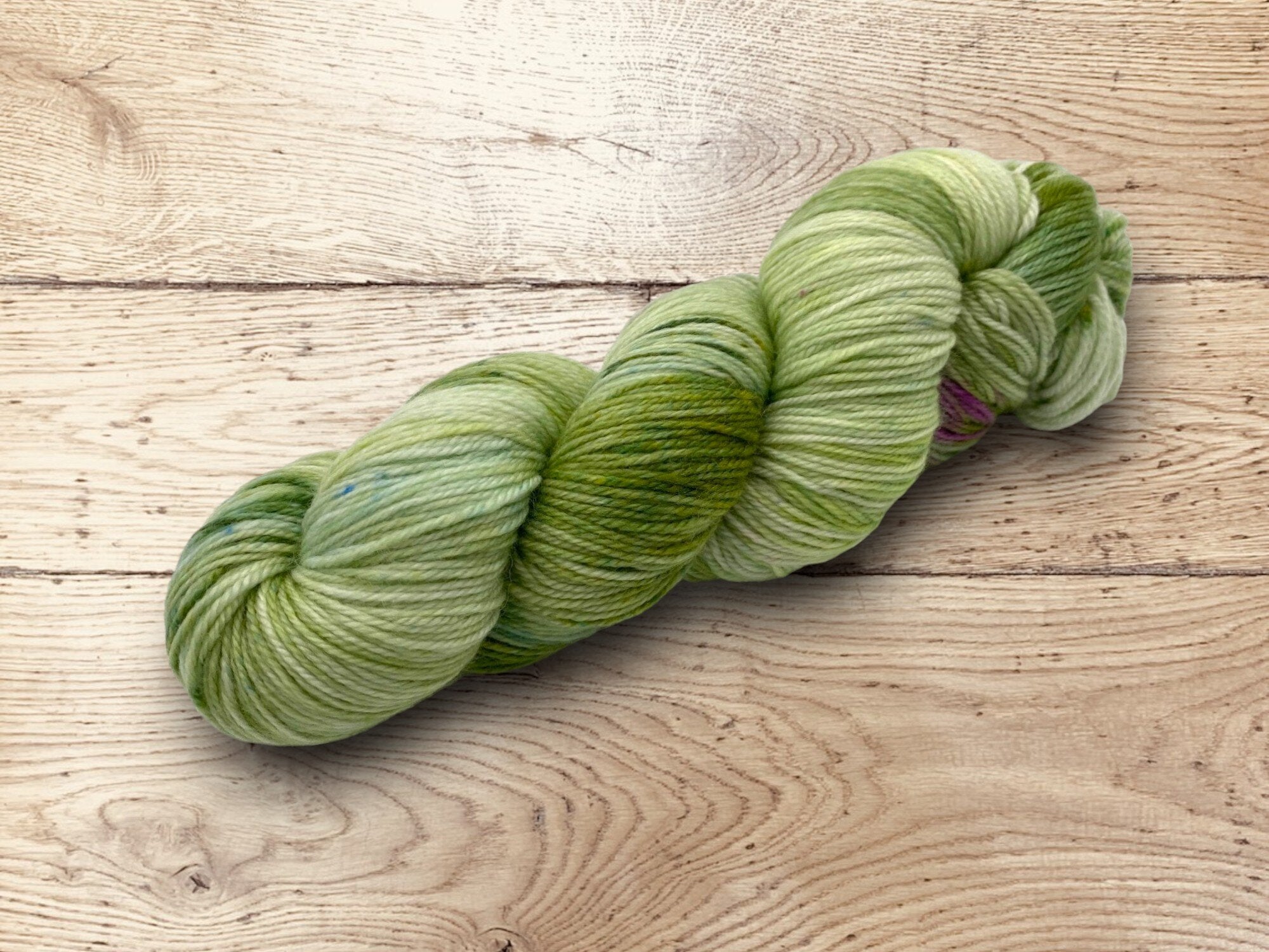 Hand dyed multiple green hues yarn by Alegria Yarn by Manos del Uruguay. 75% Superwash Merino Wool, 25% Polyamide (Nylon) for durability.
