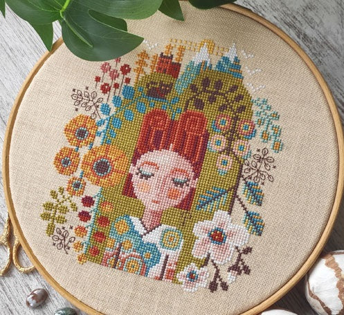 The "Garden of Dreams" cross stitch chart by Barbara Ana Designs, featuring a whimsical, surrealist folk-art pattern with intricate botanical and character motifs.