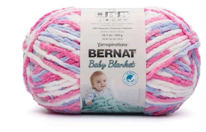 Bernat Blanket Yarn 300g 'Big Ball' in a variegated shade of pink purple and white; a high-yardage chunky yarn for fast-growing DIY home projects and cozy throws.