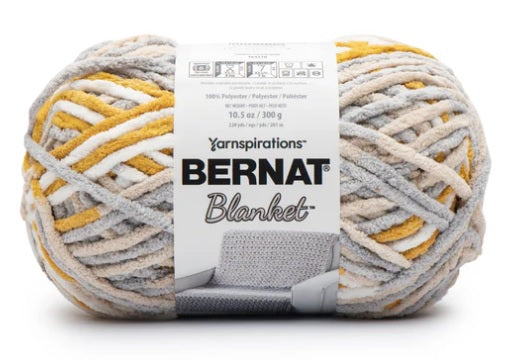 Bernat Blanket Yarn 300g 'Big Ball' in a variegated shade of yellow, grey and white; a high-yardage chunky yarn for fast-growing DIY home projects and cozy throws