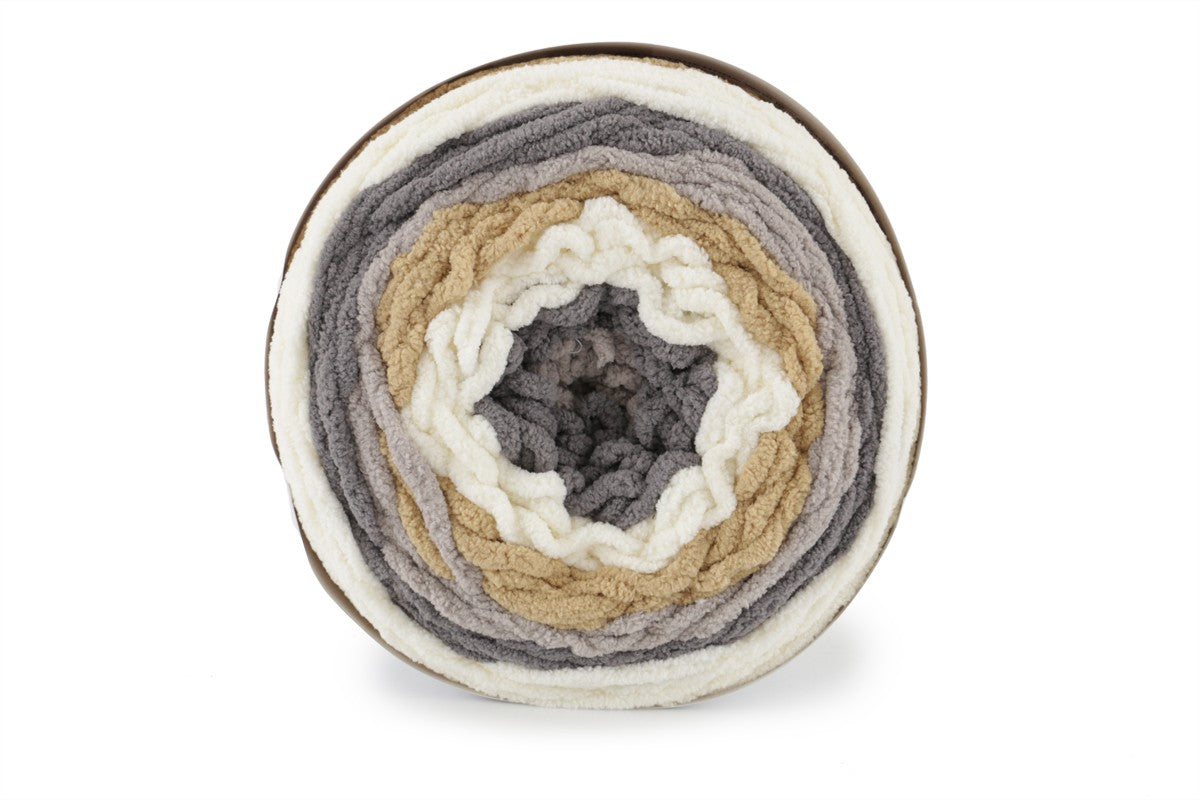 A skein of Bernat Blanket Stripes yarn in brown, gray and white colors.