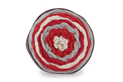 A skein of Bernat Blanket Stripes yarn in red, gray and white colors.