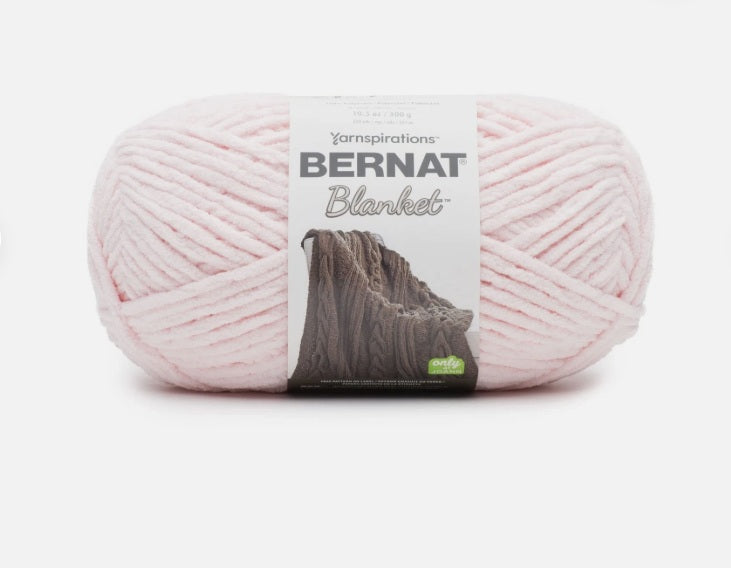 Ball of pink yarn with a Bernat Blanket label on a white background
Chunky size yarn for knitting or crocheting.