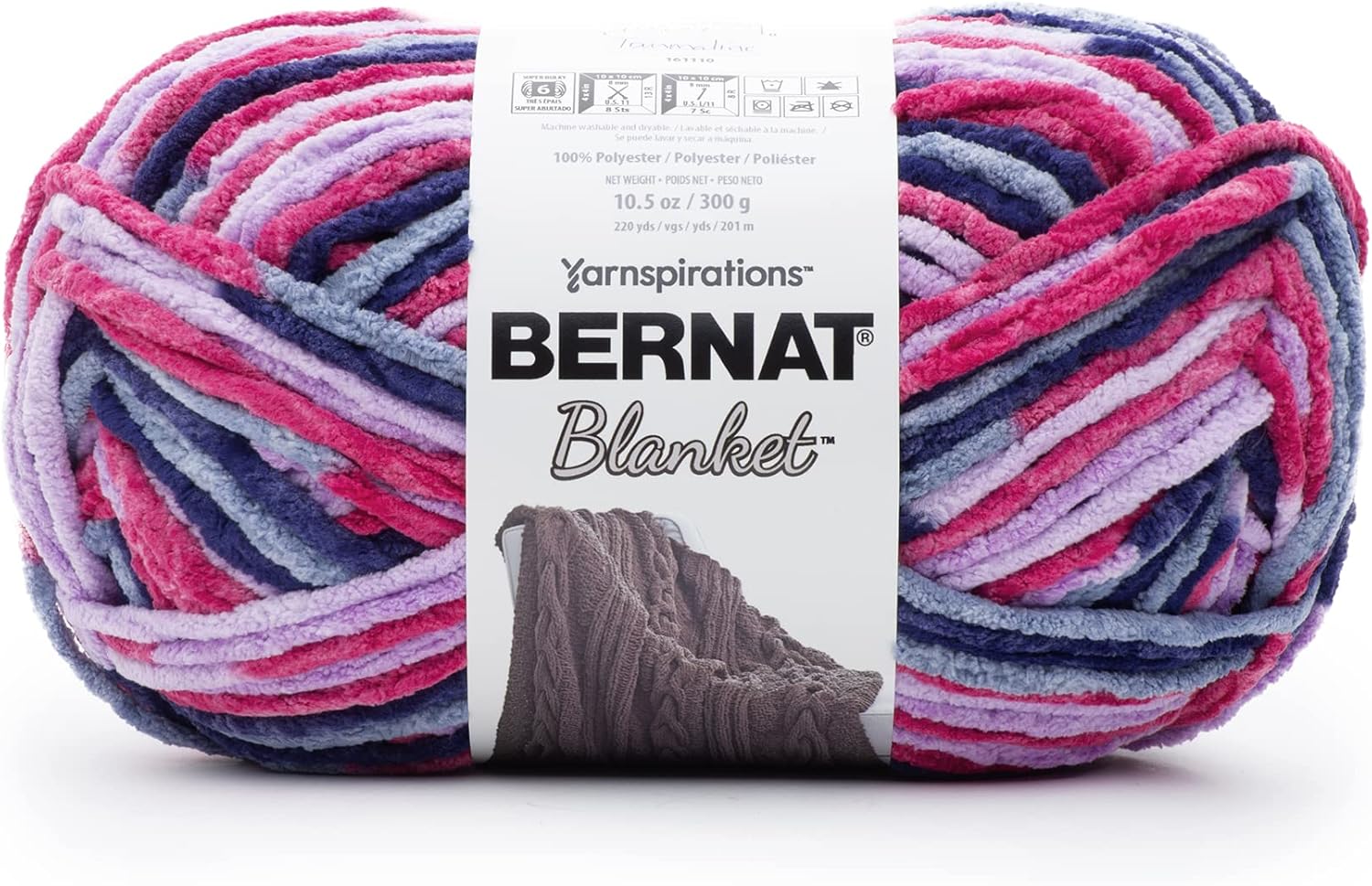 Multicolored  (lilac and Pink) skein of Bernat Blanket yarn with label.
Bernat Blanket Yarn 300g 'Big Ball' in a variegated shade of blue hue; a high-yardage chunky yarn for fast-growing DIY home projects and cozy throws.