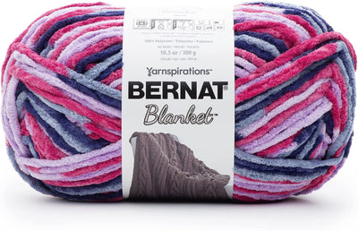 Multicolored  (lilac and Pink) skein of Bernat Blanket yarn with label.
Bernat Blanket Yarn 300g 'Big Ball' in a variegated shade of blue hue; a high-yardage chunky yarn for fast-growing DIY home projects and cozy throws.