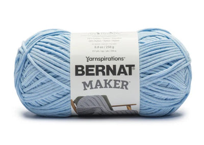 Close-up of Bernat Maker Home Dec showing the smooth jersey-tube construction and high-definition stitch work; ideal for machine-washable home decor. In sky blue colour