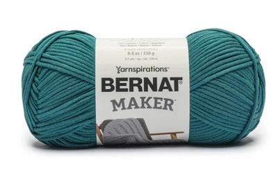 Close-up of Bernat Maker Home Dec showing the smooth jersey-tube construction and high-definition stitch work; ideal for machine-washable home decor. Teal Colour.
