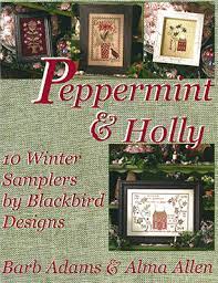 Cover of 'Peppermint & Holly: 10 Winter Samplers' book by Blackbird Designs, featuring images of holiday-themed cross stitch patterns.
