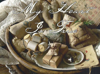 Vintage-style image with wrapped gifts and text 'My Heart Is True' on a textured background. Cross stitch primitive style book by Blackbird designs