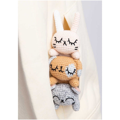 Ricorumi Pocket Pal crochet book showing a collection of colorful, miniature handmade animal figurines and characters
