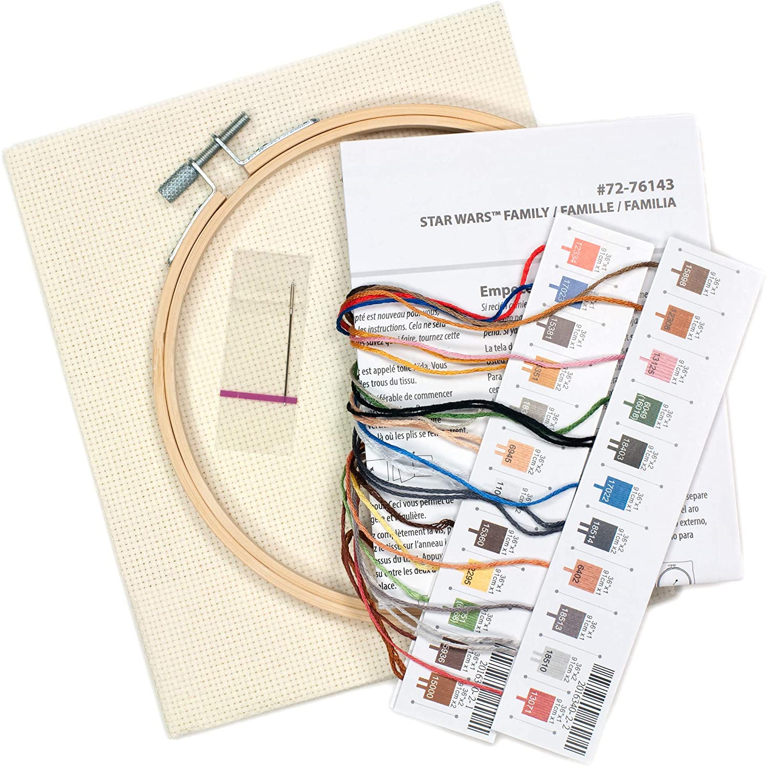 Embroidery kit with hoop, fabric, threads, and pattern chart on a white background