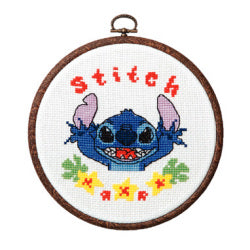 Cross-stitched design of a character with 'stitch' text in a wooden hoop.