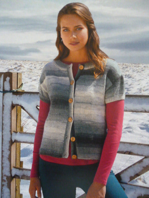 Close-up of DMC Brio yarn, showcasing the long, harmonious color transitions and the soft, rounded ply that ensures excellent stitch definition and a vibrant, striped fabric without changing yarns.