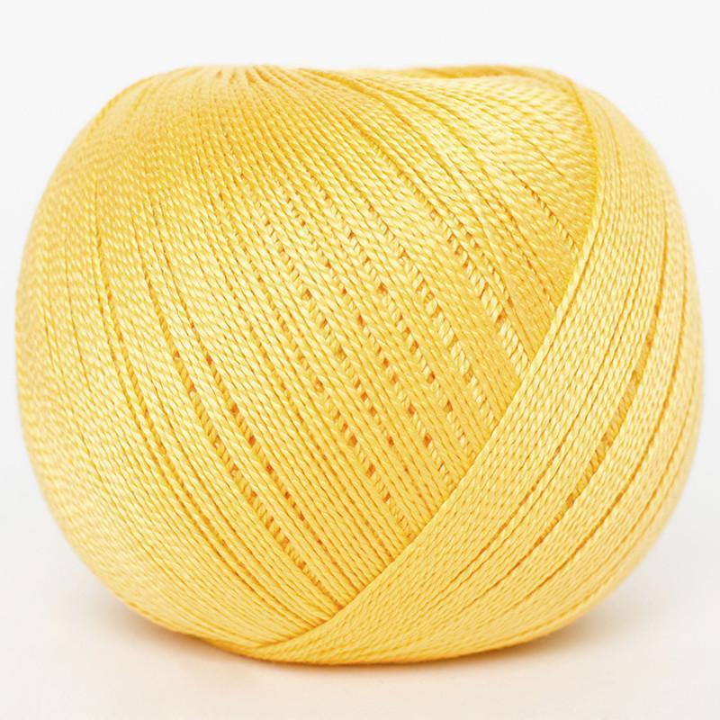 A ball of bright yellow DMC petra crochet thread on a clean white background.