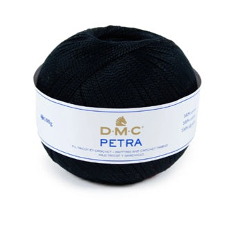 A ball of black DMC Petra yarn with a white paper label, shown on a plain white background.