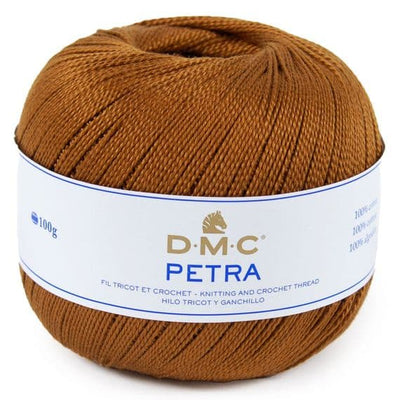A ball of DMC Petra knitting and crochet thread in a warm brown color, with a white paper label wrapped around it.