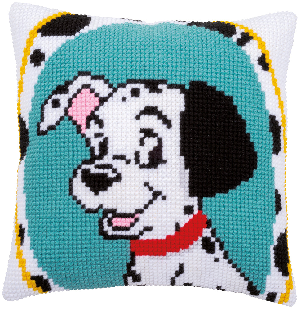 Cross-stitched dog design on a pillow with a teal background