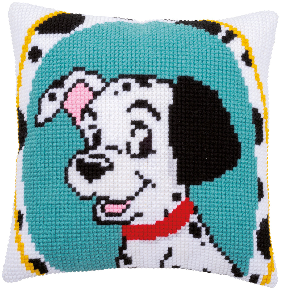 Cross-stitched dog design on a pillow with a teal background