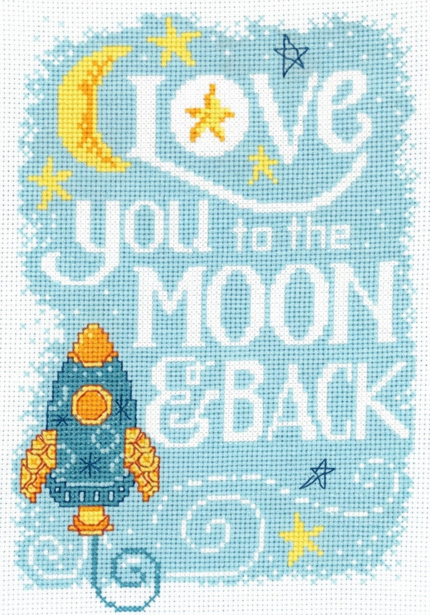 A cross stitch kit depicting a message 'I love you to the MOON & BACK' with a space and moon theme, including a rocket and stars, on a blue background.