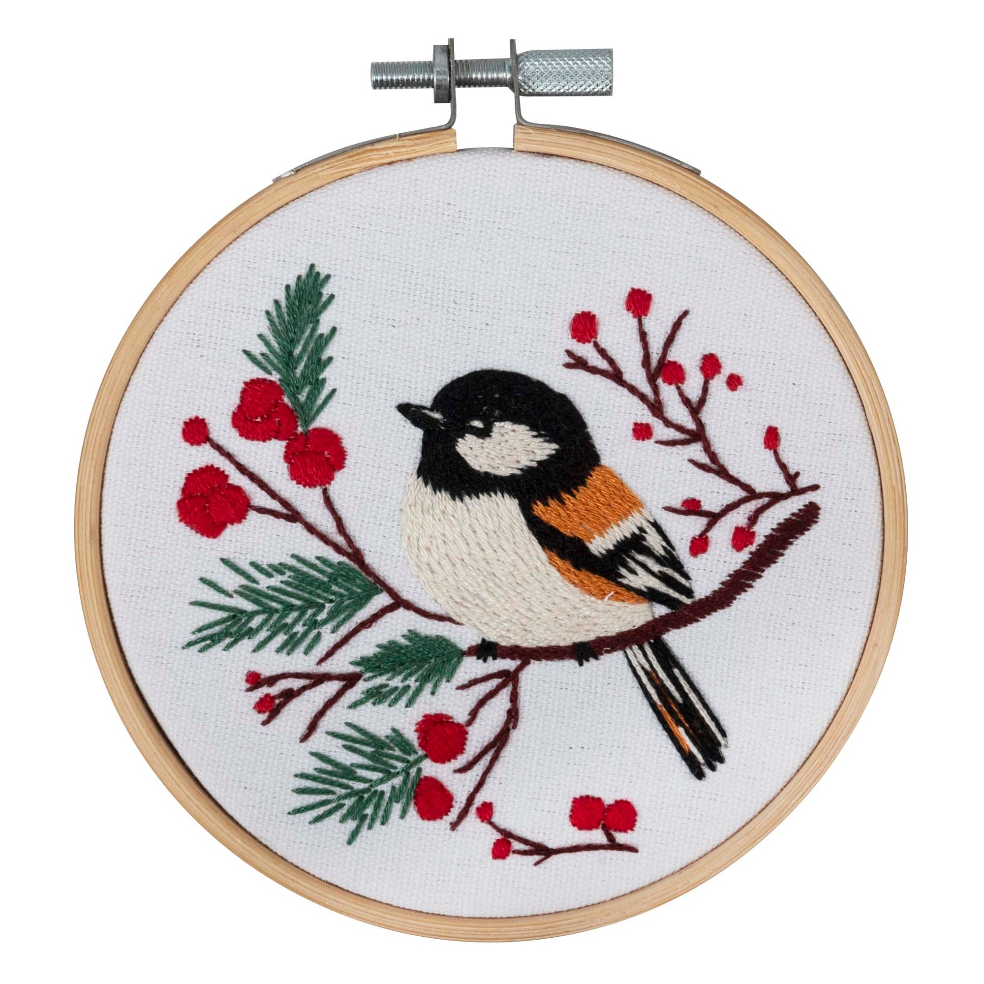 Embroidery hoop with a bird and berry design on a white background. Full kit. Christmas scenery