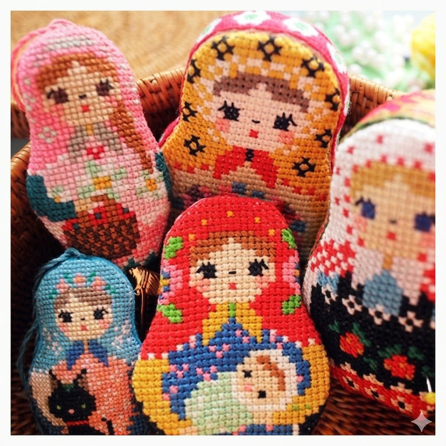 A professional cross-stitch chart by Japanese designer Kyoko Maruoka of GERA!, titled Matryoshka Set II. The design features a second unique iteration of a Russian nesting doll with vibrant, contemporary folk-art motifs.