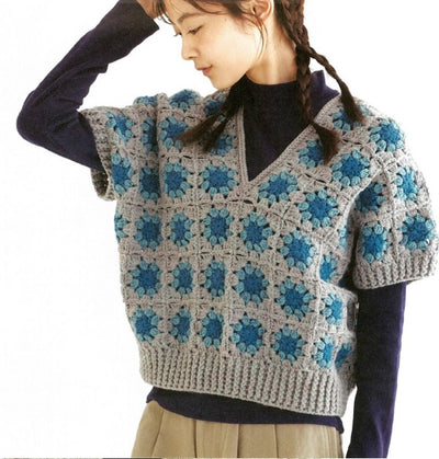 A finished Crochet granny square Vest styled in a modern, minimalist outfit, inspired by the book's patterns