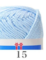 A variety of colorful Hamanaka Cotton Nottoc yarn skeins, with a focus on a green skein in the foreground. The yarn is made in Japan and is advertised for crafting and crochet.
