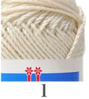 A skein of Hamanaka Cotton Nottoc yarn from Japan, showing its unique knotted texture and natural matte finish in a neutral earthy tone Ecru colour
