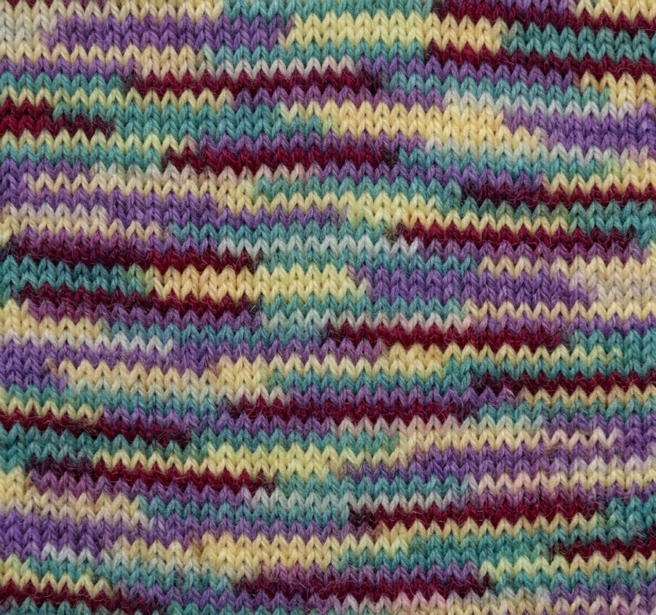Multicolored knitted fabric with a wavy pattern with Hamanaka KORPOKKUR Multi-Colour Yarn | Made in Japan