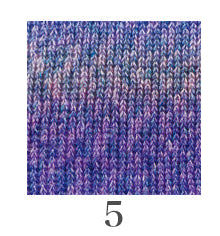 A 25-gram ball of Hamanaka Linen Floria yarn, made in Japan. This yarn features a beautiful variegated colorway with soft, painterly transitions. The strand has a unique texture reflecting its 49% linen content, blended with 51% acrylic for a soft yet structured finish