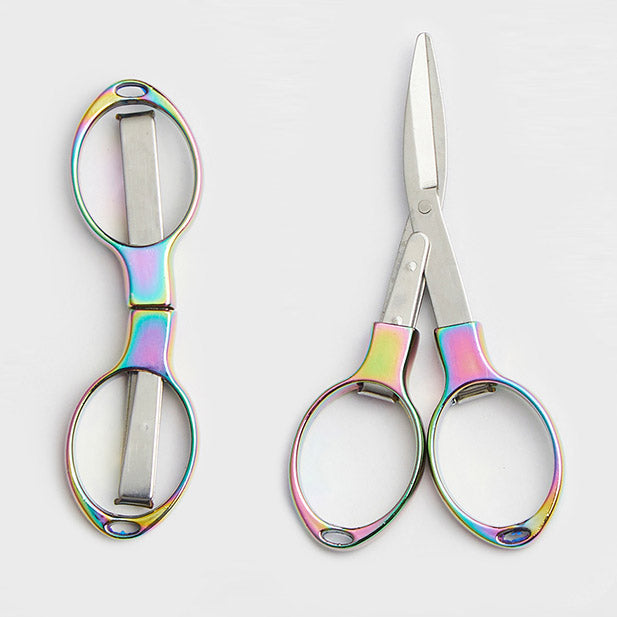 KnitPro Rainbow Folding Scissors showing the brilliant iridescent metal finish and the compact folded position