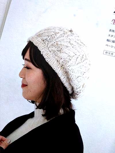 model wearing a white knitted cable beret