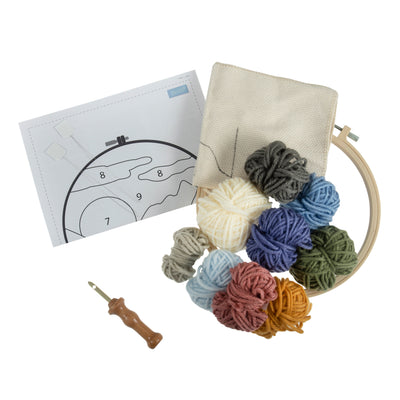 materials inside "Landscape" Punch Needle Kit By Trimits with punch needle and hoop
