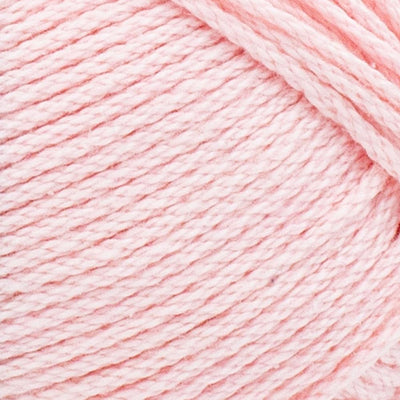A skein of Lion Brand 24/7 Cotton yarn, highlighting the shiny mercerized finish and tightly plied 100% cotton texture in Pink Lemonade colour