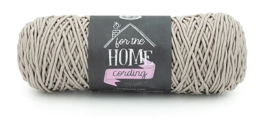 A versatile skein of Lion Brand Cording Yarn, ideal for crocheting and knitting sturdy home items like storage baskets, floor poufs, plant hangers, and decorative placemats.