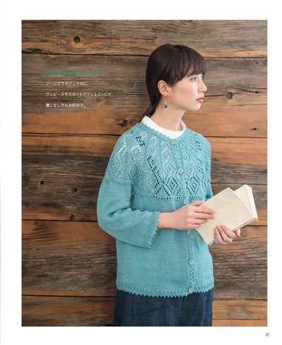 Close-up of the seamless shoulder transition on a knitted cardigan, highlighting the professional finish of neck-down construction