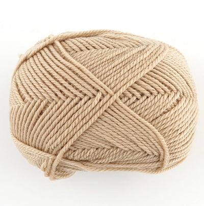 A 30g donut-style ball of Pierrot Fine Merino yarn. The image showcases the smooth, tightly spun plies of 100% Extra Fine Merino wool, reflecting the high-quality Japanese craftsmanship and the soft, matte finish characteristic of premium boutique yarns in biscuit beige colour.