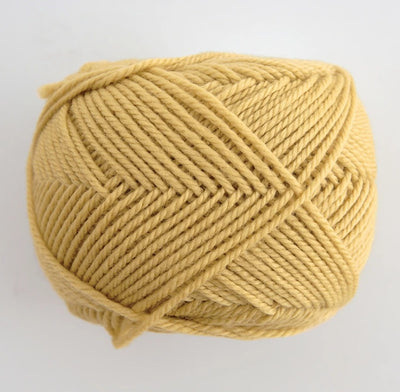 A 30g skein of Pierrot Fine Merino yarn in a soft matte finish, showing the delicate, tightly twisted 100% extra fine merino wool in mustard colour