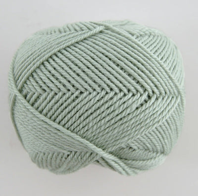 Close-up of premium Japanese Pierrot Fine Merino wool, showcasing the smooth, anti-pilling texture and fine weight suitable for intricate knitting in pale green colour