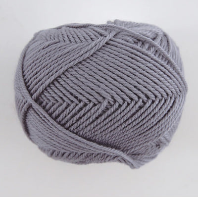 A 30g skein of Pierrot Fine Merino yarn in a soft matte finish, showing the delicate, tightly twisted 100% extra fine merino wool in ash grey colour.