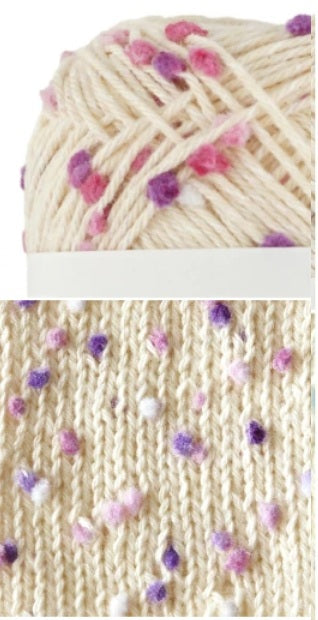 Spool of yarn with pink and purple heart patterns and a close-up of knitted fabric with similar patterns. cotton yarn Made in Japan. great for knitting summer wear