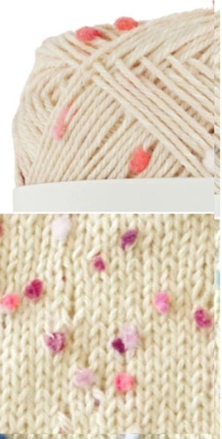 Close-up of beige yarn with pink, lilac and purple heart patterns and a knitted fabric sample. cotton yarn Made in Japan. Knit summer wear and accessories