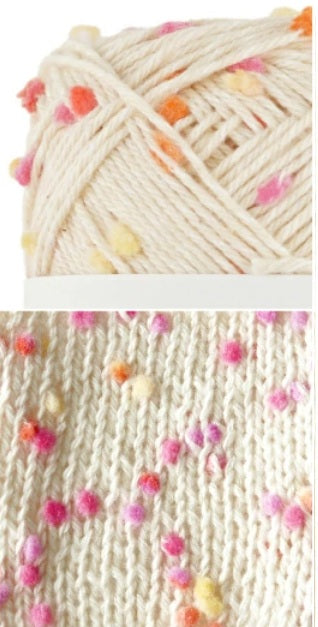pink yellow orange Ball of yarn with colorful pom-poms and a close-up of knitted fabric with pom-poms. cotton yarn Made in Japan. great for summer wear