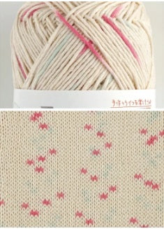 Macro shot of the knitted fabric made from Little Fun yarn, showing the unique 'dancing dot' effect and crisp stitch definition with pink and light sky blue. Pierrot Little Fun Yarn, Japanese Cotton Yarn, Kasuri Style Cotton, Boutique Japanese Fiber, Pierrot Yarn Singapore