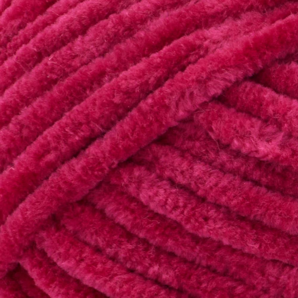 Close-up of Premier Parfait Chunky polyester yarn, highlighting the dense, plush pile and vibrant color in berry red colour