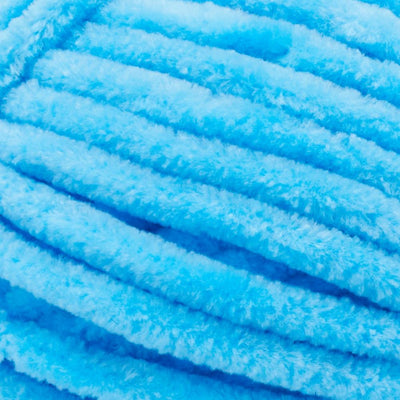 Close-up of Premier Parfait Chunky polyester yarn, highlighting the dense, plush pile and vibrant color in azure blue colour