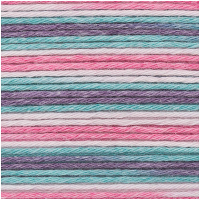 Close-up of the smooth, matte finish of the Baby Cotton Soft Print yarn, showing the clean ply and vibrant 'print' color transitions from pink to turquoise
